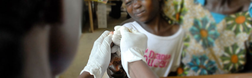 volunteer vaccinating child